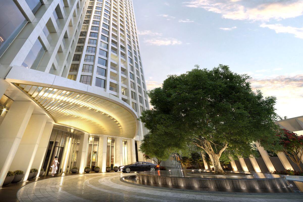 Aurelia Residences tower entrance with landscaped driveway