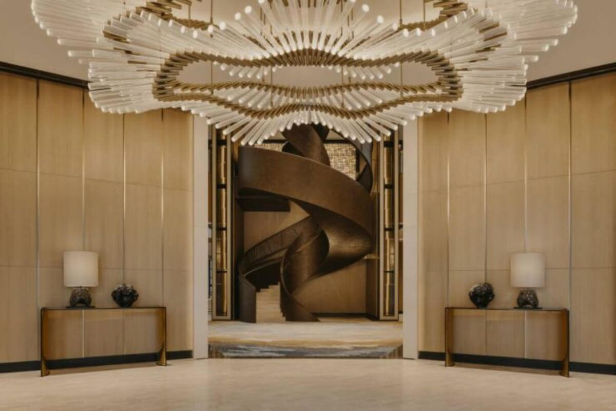 Luxury condominium lobby interior with elegant chandelier lighting and premium architectural design at Aurelia Residences.