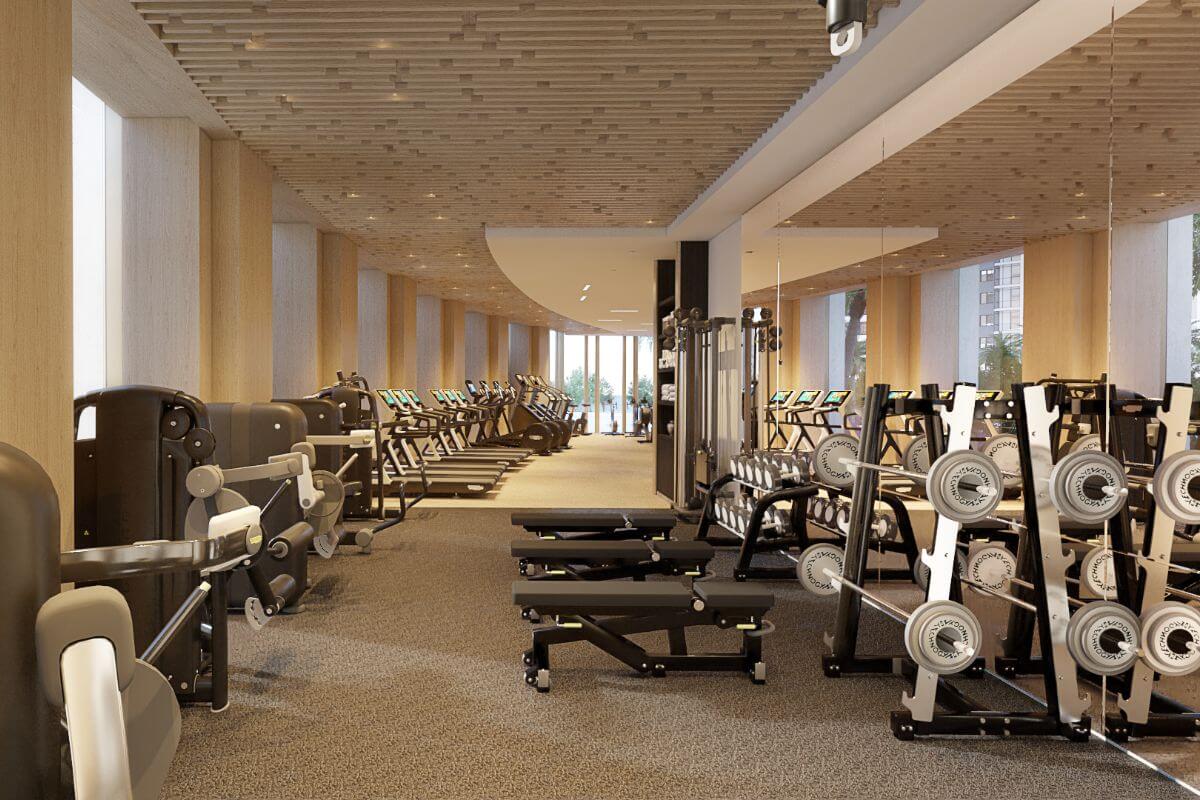 Modern fitness center with cardio machines, weight equipment, and refined interior finishes