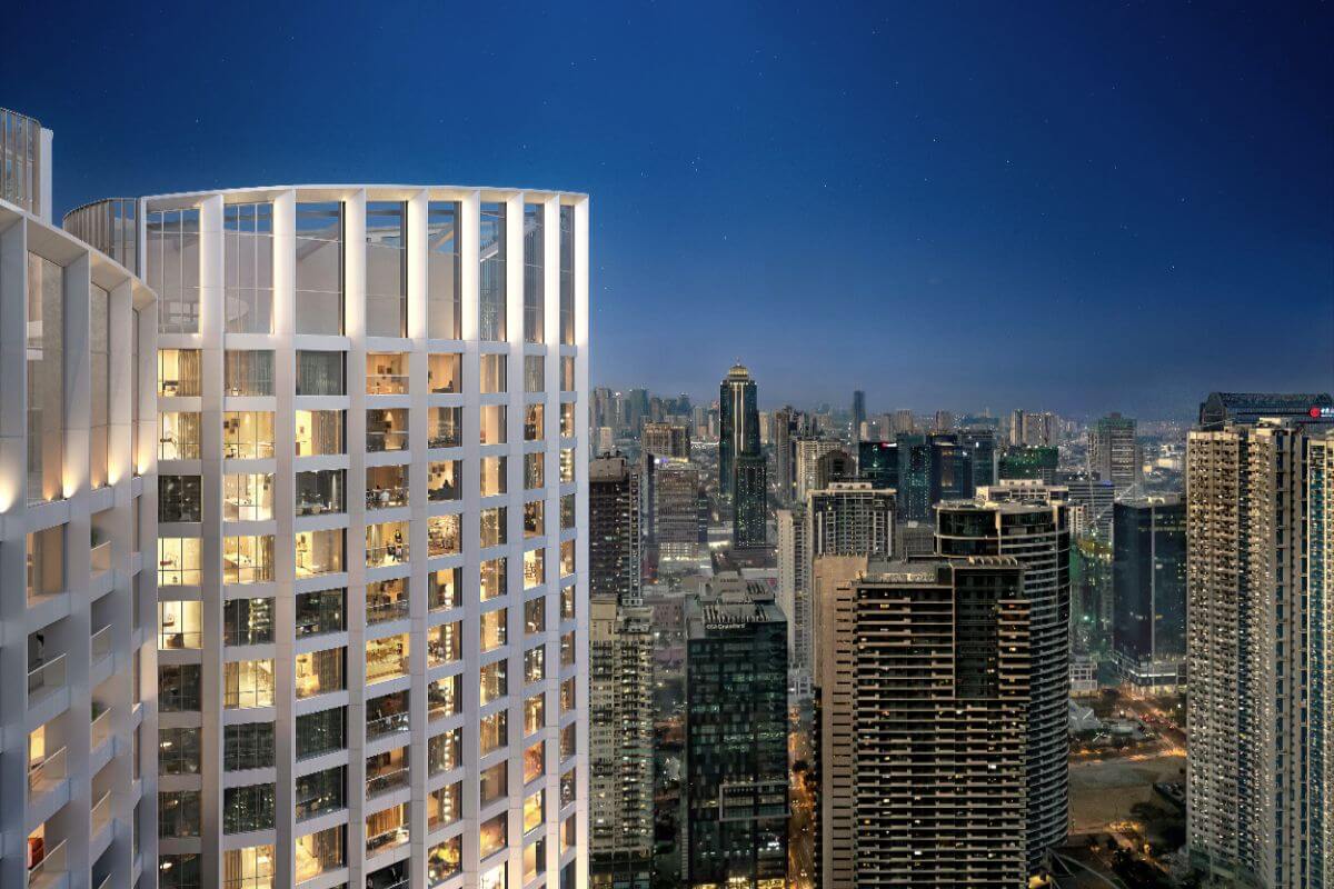 Night view of an ultra-luxury residential tower overlooking the Bonifacio Global City skyline