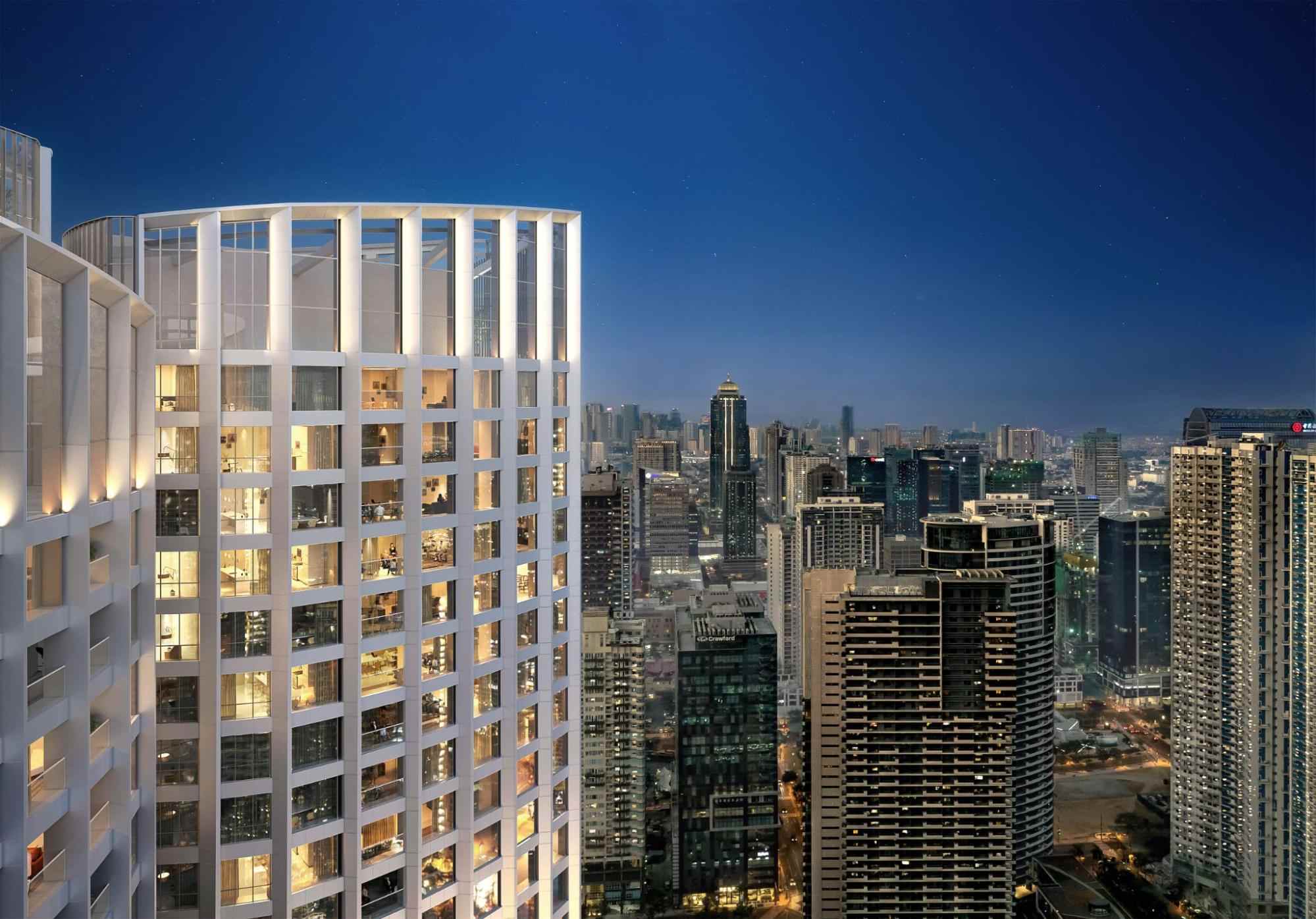 Luxury high-rise condominium with illuminated windows overlooking the BGC skyline at night