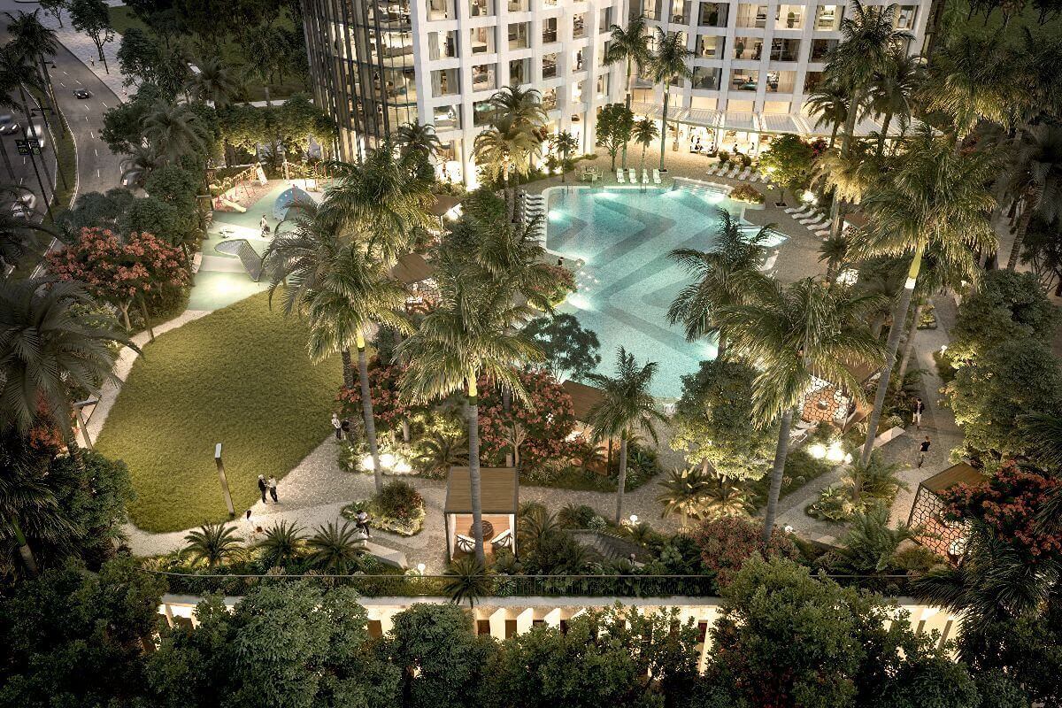 Aerial view of the resort-style swimming pool and landscaped gardens at Aurelia Residences