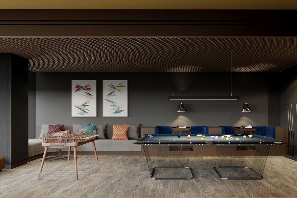 Luxury game room with a billiards table, chess table, lounge seating, and contemporary artwork