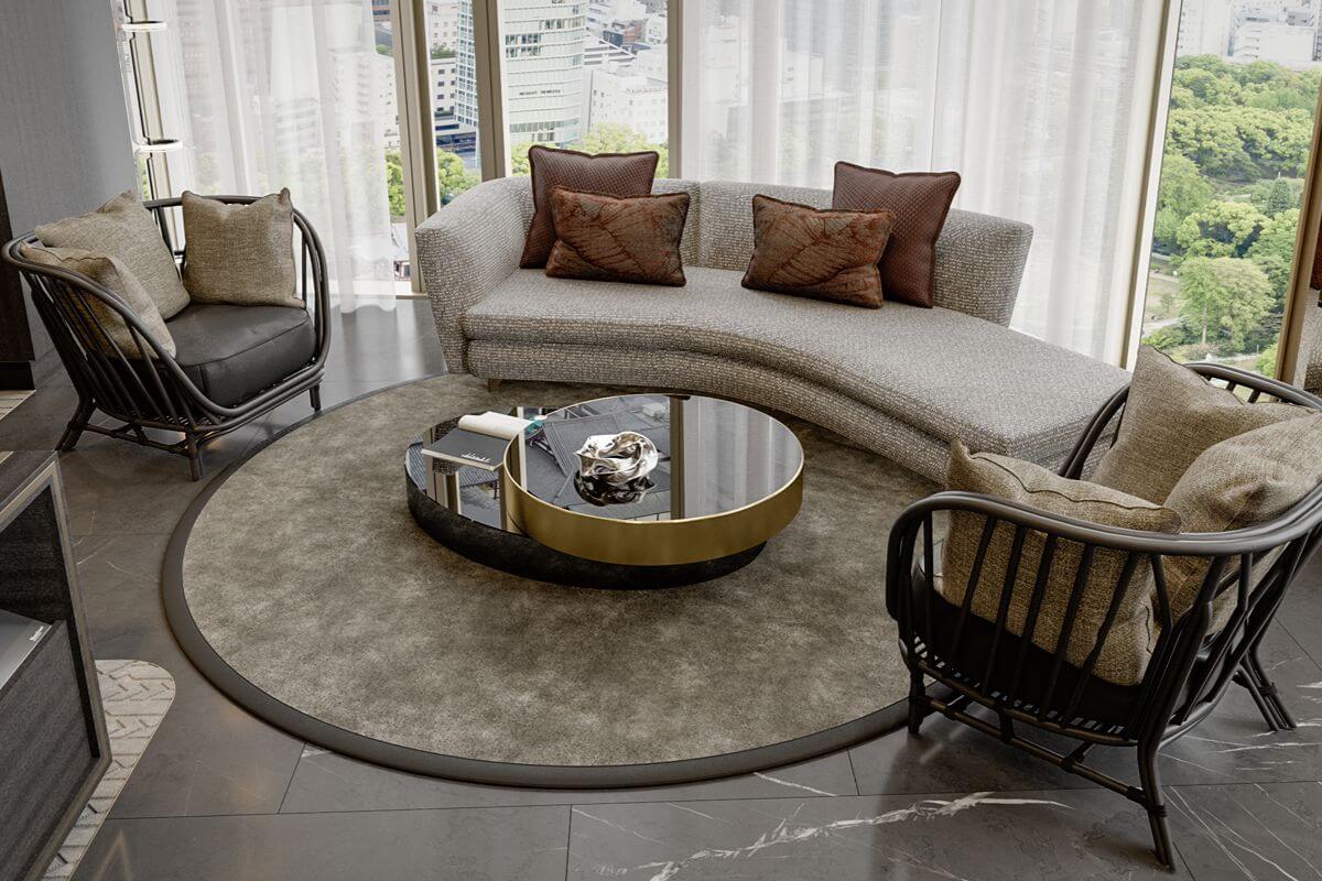 Curved sofa and lounge chairs beside floor-to-ceiling windows overlooking greenery and the BGC cityscape