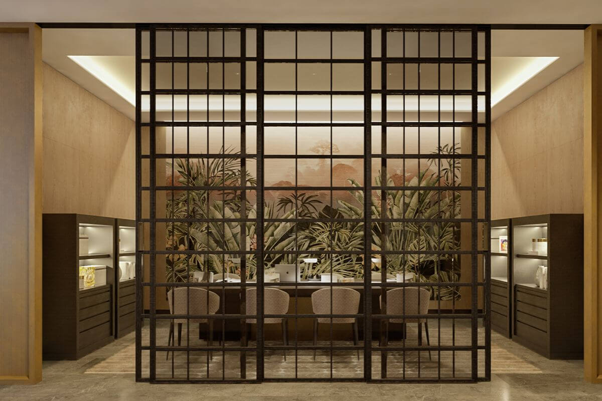 Elegant Aurelia Residences lounge with decorative partition, refined seating, and warm interior lighting