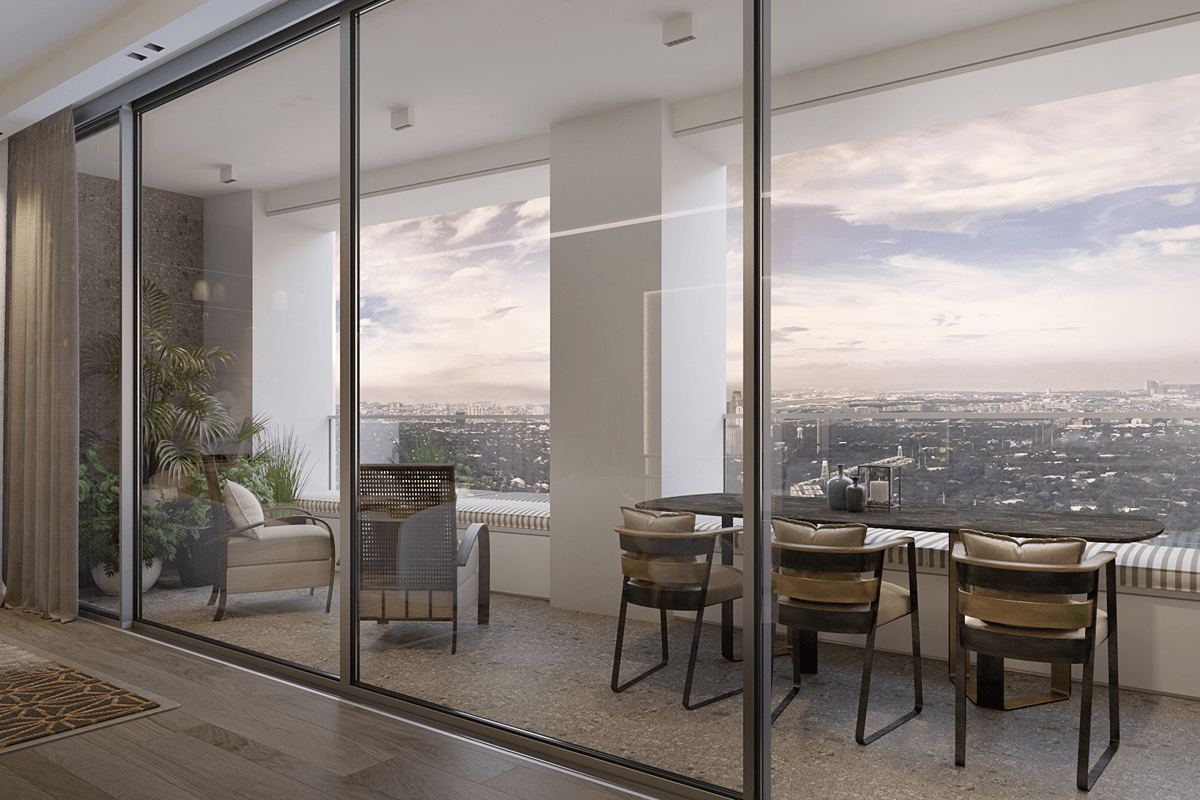 Spacious Aurelia Residences dining area with floor-to-ceiling glass doors and panoramic city views
