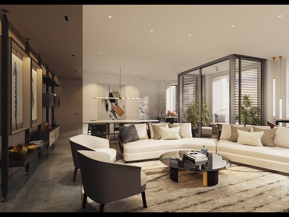 Spacious Aurelia Residences living room with curved sofas, modern furnishings, warm finishes, and an open layout designed for luxury living