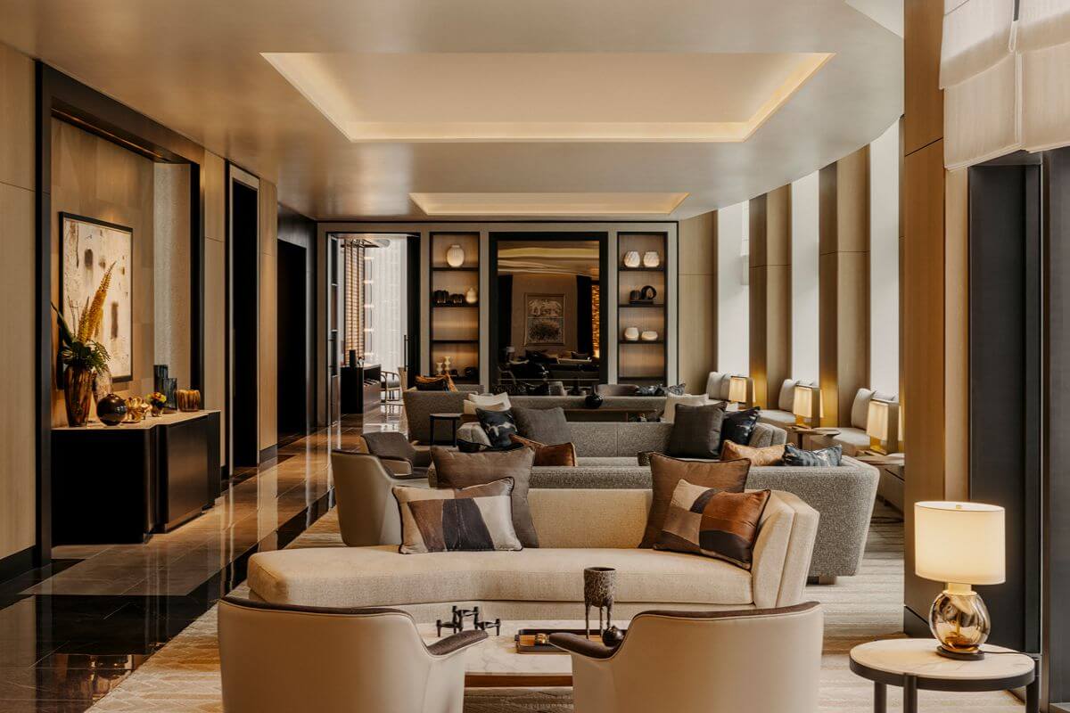 Elegant luxury condominium lounge with refined seating, warm lighting, and sophisticated interior finishes