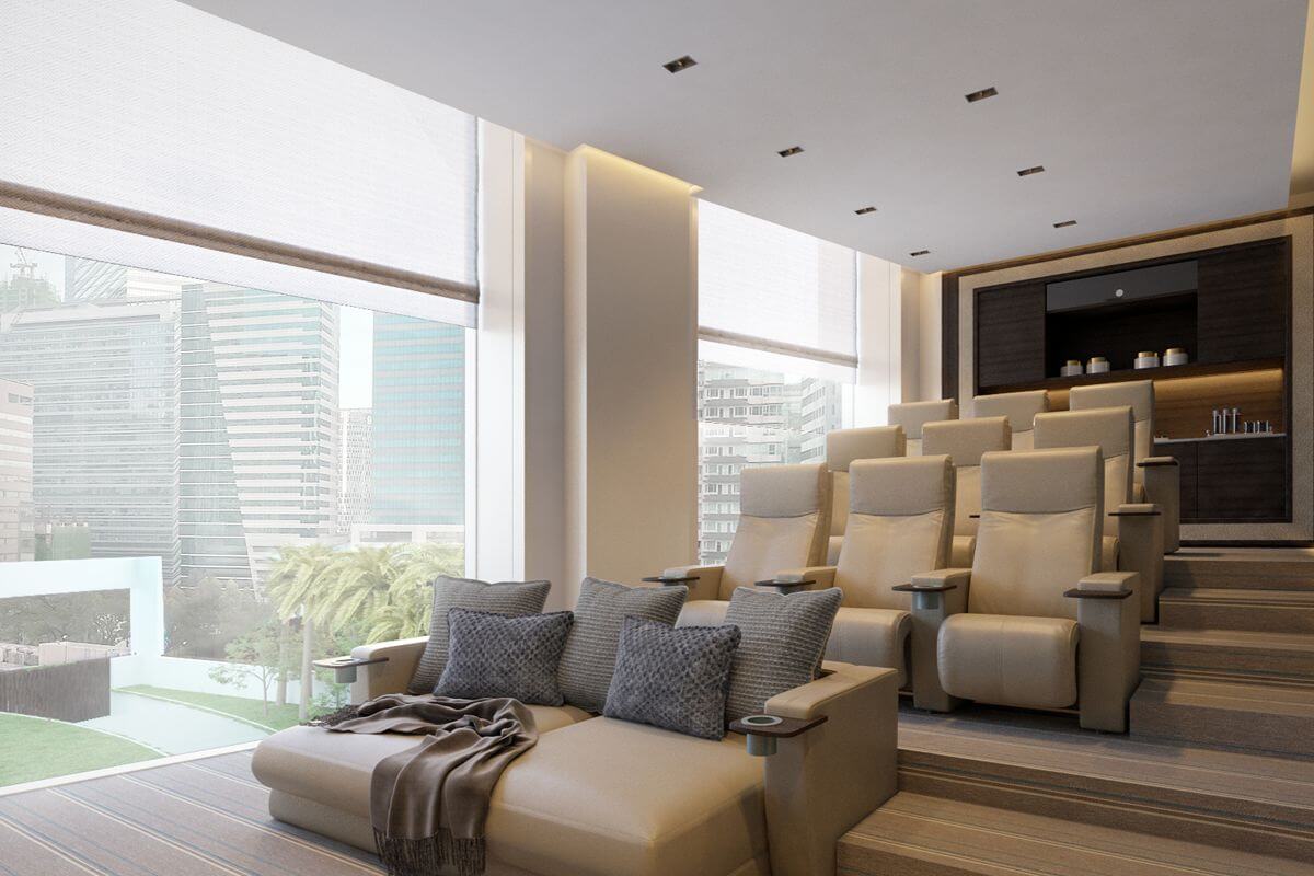 Private home cinema with tiered seating and floor-to-ceiling windows overlooking the city